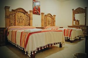 A bed or beds in a room at HOTEL SAN JUDAS