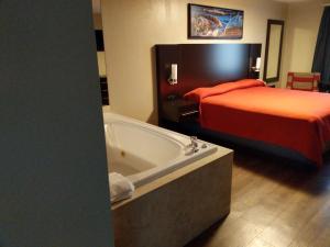 A bed or beds in a room at Riverside Tower