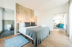 a bedroom with a large bed in a room at Plaza de España Skyline in Madrid