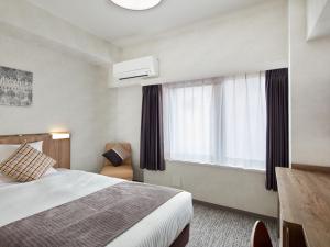 מיטה או מיטות בחדר ב-HOTEL MYSTAYS Kiyosumi Shirakawa