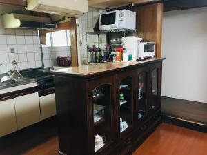 A kitchen or kitchenette at Guest Inn Chita