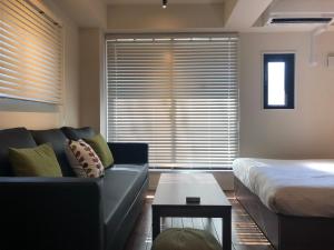 Кровать или кровати в номере Condominium MIRAHAKONE