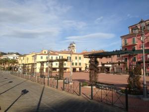 a street in a city with buildings in the background at Affittacamere Vista Mare in Porto Azzurro