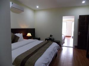 เตียงในห้องที่ Sapa Meriton Boutique Hotel