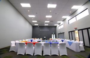 a large room with tables and chairs in it at Travelodge Kasane in Kasane