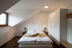 a bedroom with a bed in a attic at Guesthouse Stari Mayr in Kranj