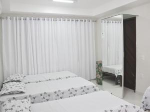 Una cama o camas en una habitación de Casa OhVidaBoa com 6 suítes