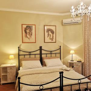 Cama ou camas em um quarto em Villa Toscana