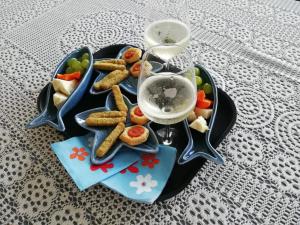 a plate of food with cookies and vegetables on a table at Hotel Madalù in Rimini