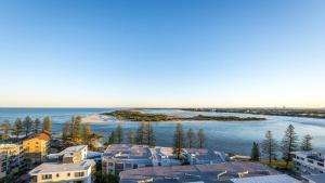 an aerial view of a city and a body of water at Centrepoint Apartments Caloundra in Caloundra