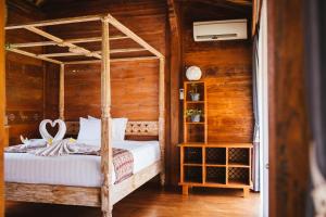 Cama ou camas em um quarto em Baligong Villa