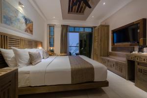 Tempat tidur dalam kamar di Hotel Ocean Grand at Hulhumale