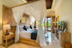 Кровать или кровати в номере Bliss Ubud Spa Resort