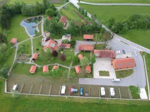 an aerial view of a house with cars parked in front at Camp Podgrad Vransko in Vransko