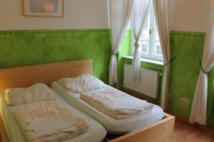 Кровать или кровати в номере Hostel Louise 20