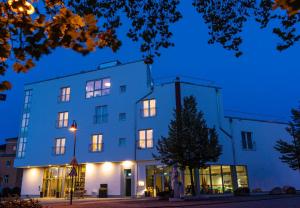 a building with lights on at night at Mythenresort Heimdall in Thale