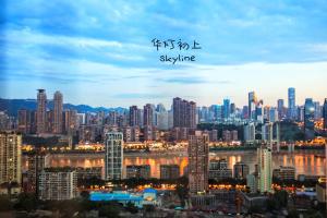 a view of a large city at night at 弱水咖啡国际青旅Only Cafe and Backpacker in Chongqing