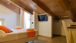 A television and/or entertainment centre at Duomo Attic (rooms)