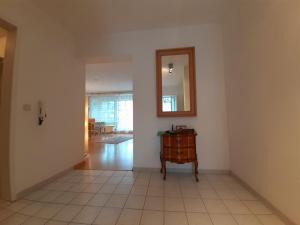 an empty room with a mirror and a table at Wohnung im Herzen von Ettlingen in Ettlingen