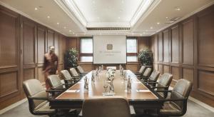 a large meeting room with a long table and chairs at The Dharmawangsa Jakarta in Jakarta