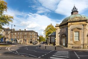 an old building on the corner of a street at The Old Sweet Factory in Harrogate