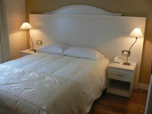 Cama ou camas em um quarto em Hôtel Vauban