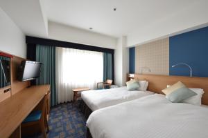 Cama ou camas em um quarto em Hotel Granvia Hiroshima