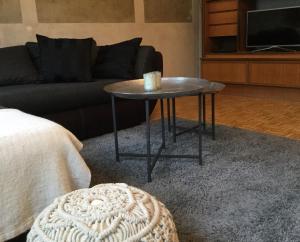 a coffee table in a living room with a couch at Beletage in Neuwied