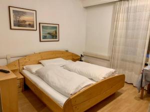 Кровать или кровати в номере B&B Hotel Dolomiti