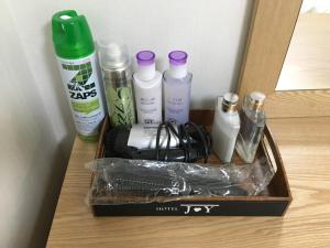 a box of beauty products sitting on a table at Hotel Joy near Camp Humphres in Pyeongtaek