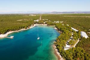 an aerial view of a harbor with a boat in the water at Crvena Luka Resort in Biograd na Moru