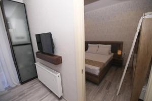 Кровать или кровати в номере Apartment Didveli 7