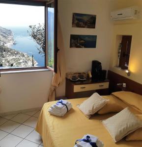 Кровать или кровати в номере B&B Ravello Rooms