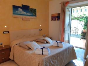 Кровать или кровати в номере B&B Ravello Rooms