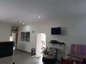 En TV eller et underholdningssystem på Xplora Hostel Cusco