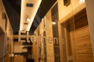 a window of a store with a sign on it at Hotel Elements in Novi Pazar