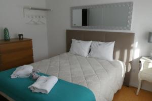 Tempat tidur dalam kamar di Casa Sandra - Apartamento Carlota