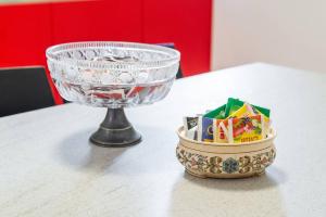 a glass bowl and a candle holder on a table at San Marco 4893 in Venice