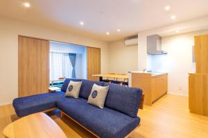 A seating area at LAPIN MIHAMA Residence Hotel