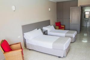 A bed or beds in a room at Apartamentos Lanzarote Paradise Colinas