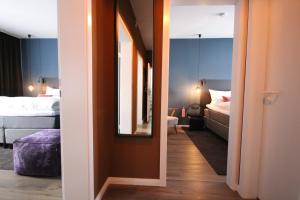 เตียงในห้องที่ ONNO Boutique Hotel & Apartments