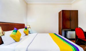 Una cama o camas en una habitación de Itsy Hotels Ammu Regency