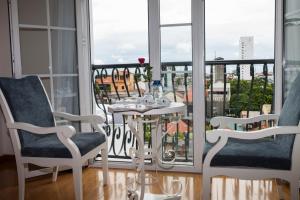 Un balcón o terraza en Hotel La Perle