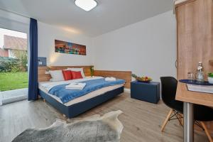 Ліжко або ліжка в номері Sunny Hotel Straubing