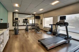 a gym with several tread machines in a room at Holiday Inn Express Baltimore BWI Airport West, an IHG Hotel in Hanover