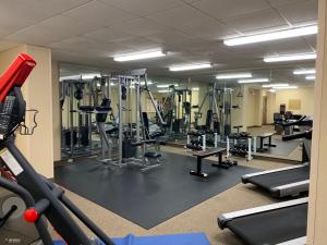 a gym with several treadmills and machines at Candlewood Suites Jonesboro, an IHG Hotel in Jonesboro