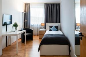 Кровать или кровати в номере Hotel Birkenstern