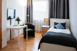 Кровать или кровати в номере Hotel Birkenstern