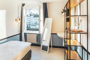 เตียงในห้องที่ Pop Up Hotel Krone Zürich