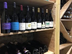 a bunch of wine bottles on a shelf at Le Thalassa Hôtel & Spa in Camaret-sur-Mer